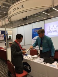 Jose Andres Garcia (Estrategia Global) with Bill Jordan (Allied Tool & Die)